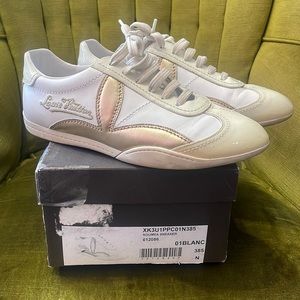 Louis Vuitton white patent leather and gold sneaker